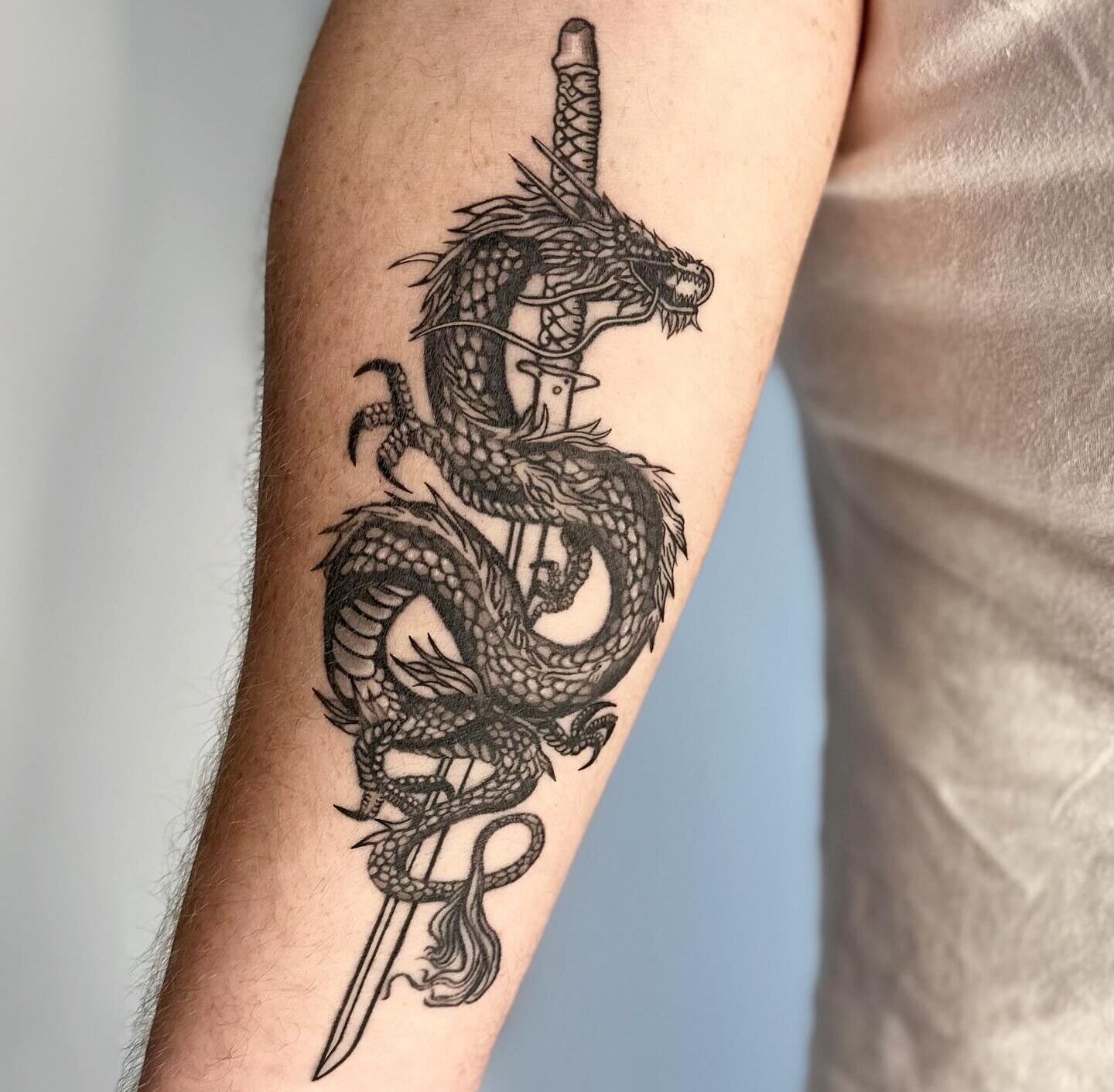 Dragon and Samurai Sword tattoo by tattoo artist Marcus Kingsland at Markings Tattoos in Beverley, East Riding of Yorkshire.