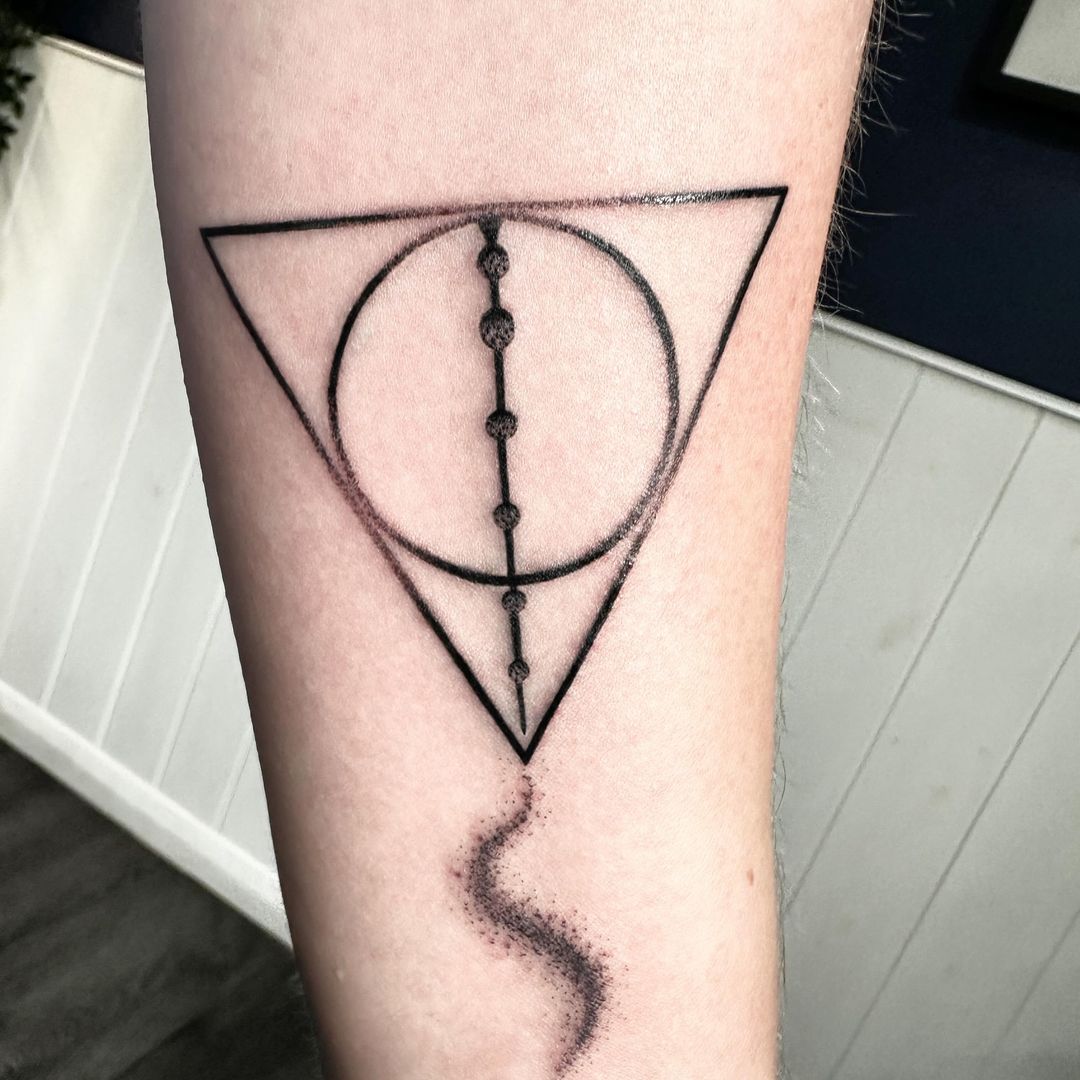 Harry Potter 'Deathly Hallows' tattoo by artist Marcus Kingsland at Markings Tattoos in Beverley, East Riding of Yorkshire.