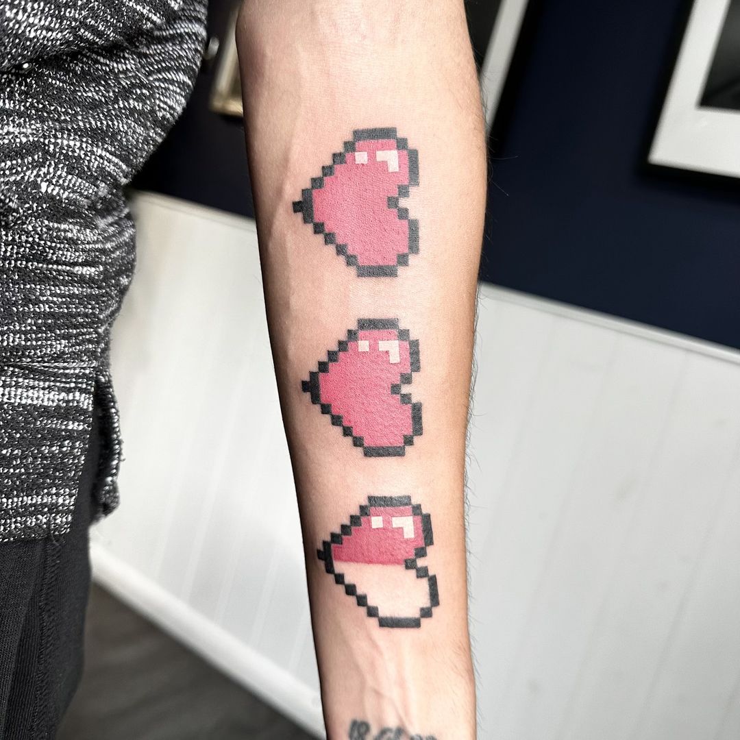 Pixel hearts tattoo by artist Marcus Kingsland at Markings Tattoos in Beverley, East Riding of Yorkshire.