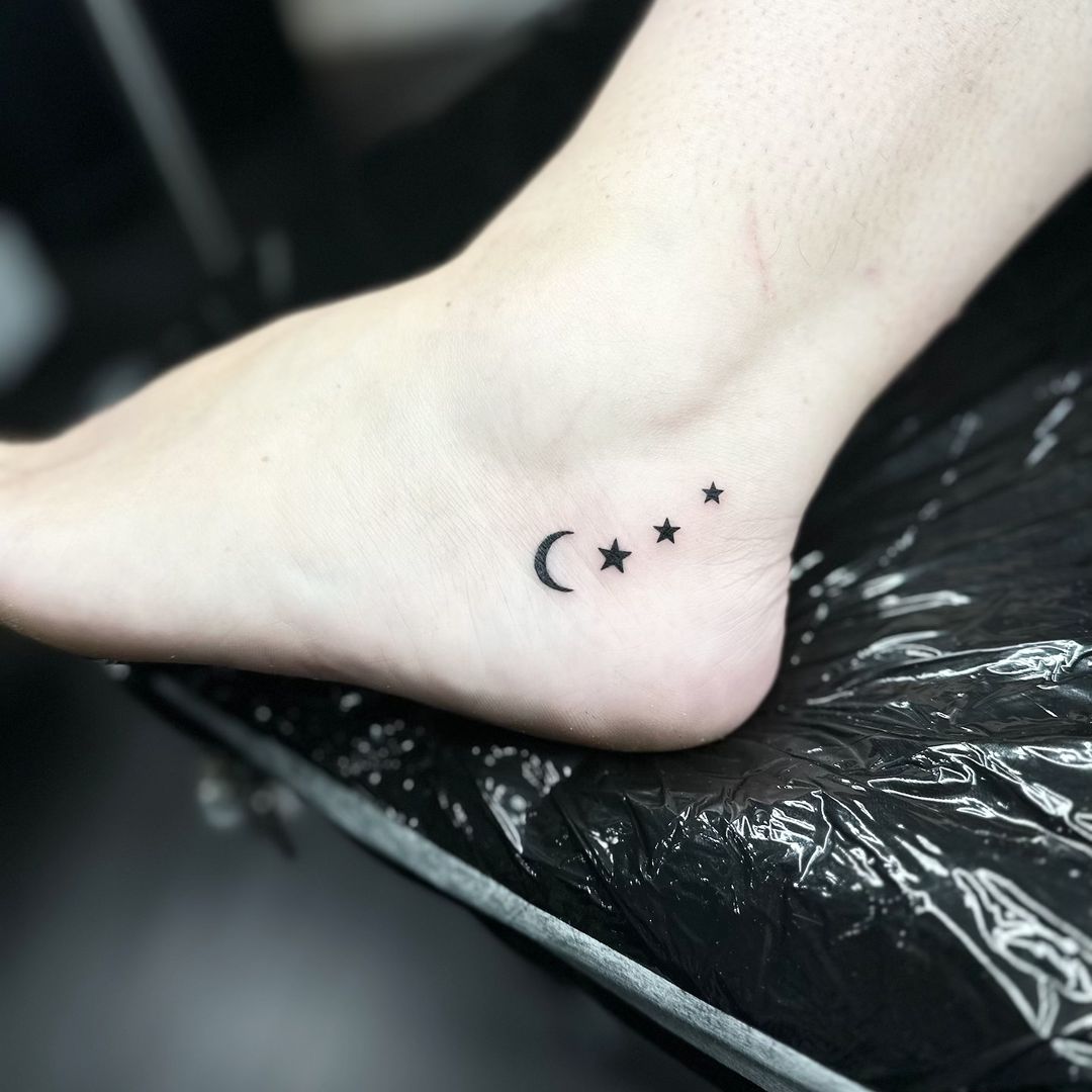 Moon and stars tattoo by artist Marcus Kingsland at Markings Tattoos in Beverley, East Riding of Yorkshire.