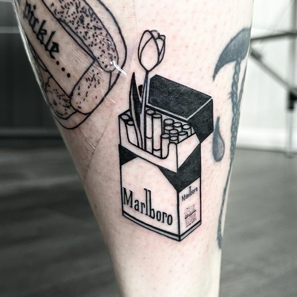 Marlboro cigarettes tattoo by artist Marcus Kingsland at Markings Tattoos in Beverley, East Riding of Yorkshire.