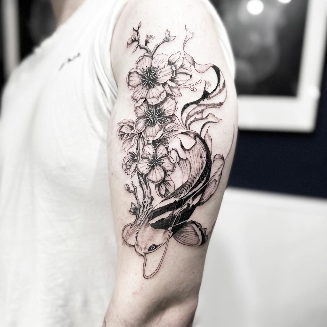 Koi & Cherry Blossom tattoo by artist Marcus Kingsland at Markings Tattoos in Beverley, East Riding of Yorkshire.