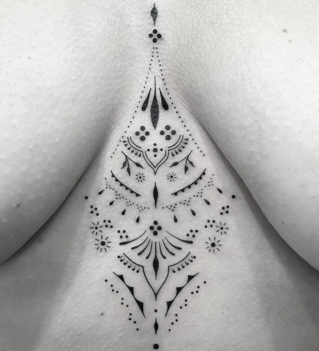 Sternum mandala tattoo by artist Marcus Kingsland at Markings Tattoos in Beverley, East Riding of Yorkshire.