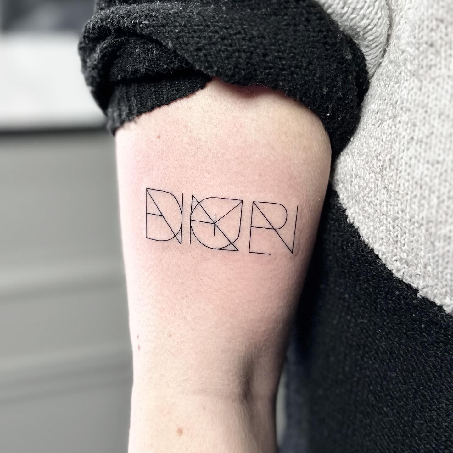 Family initials tattoo by artist Marcus Kingsland at Markings Tattoos in Beverley, East Riding of Yorkshire.